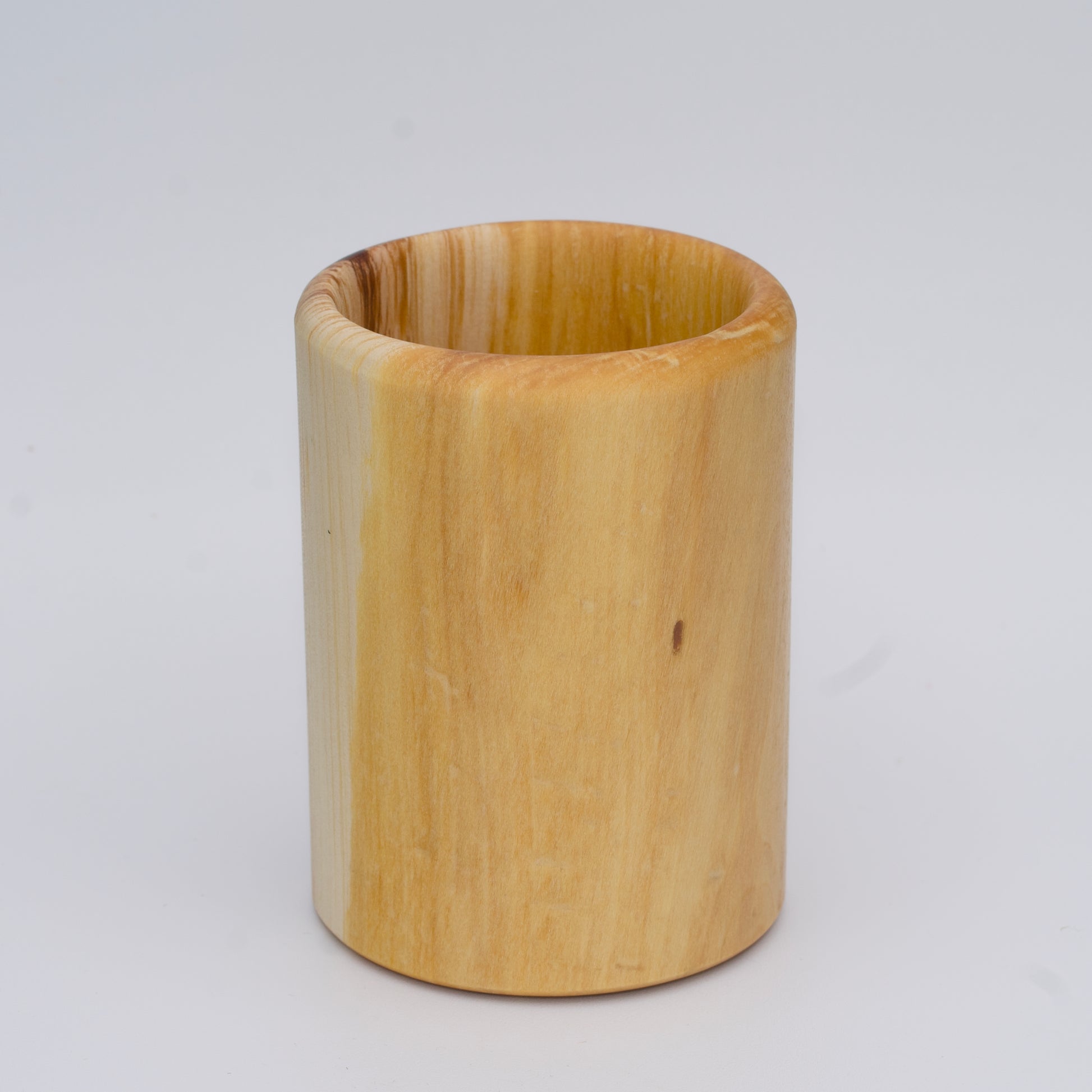 Aspen wood shot glass against white background