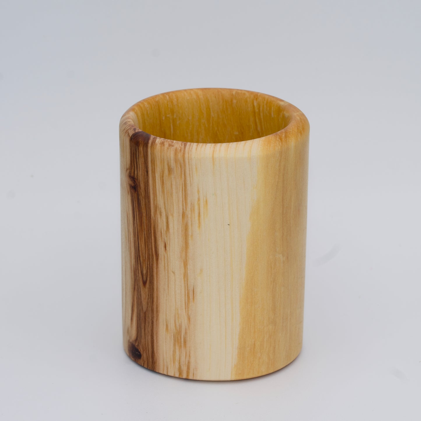 Aspen wood shot glass against white background