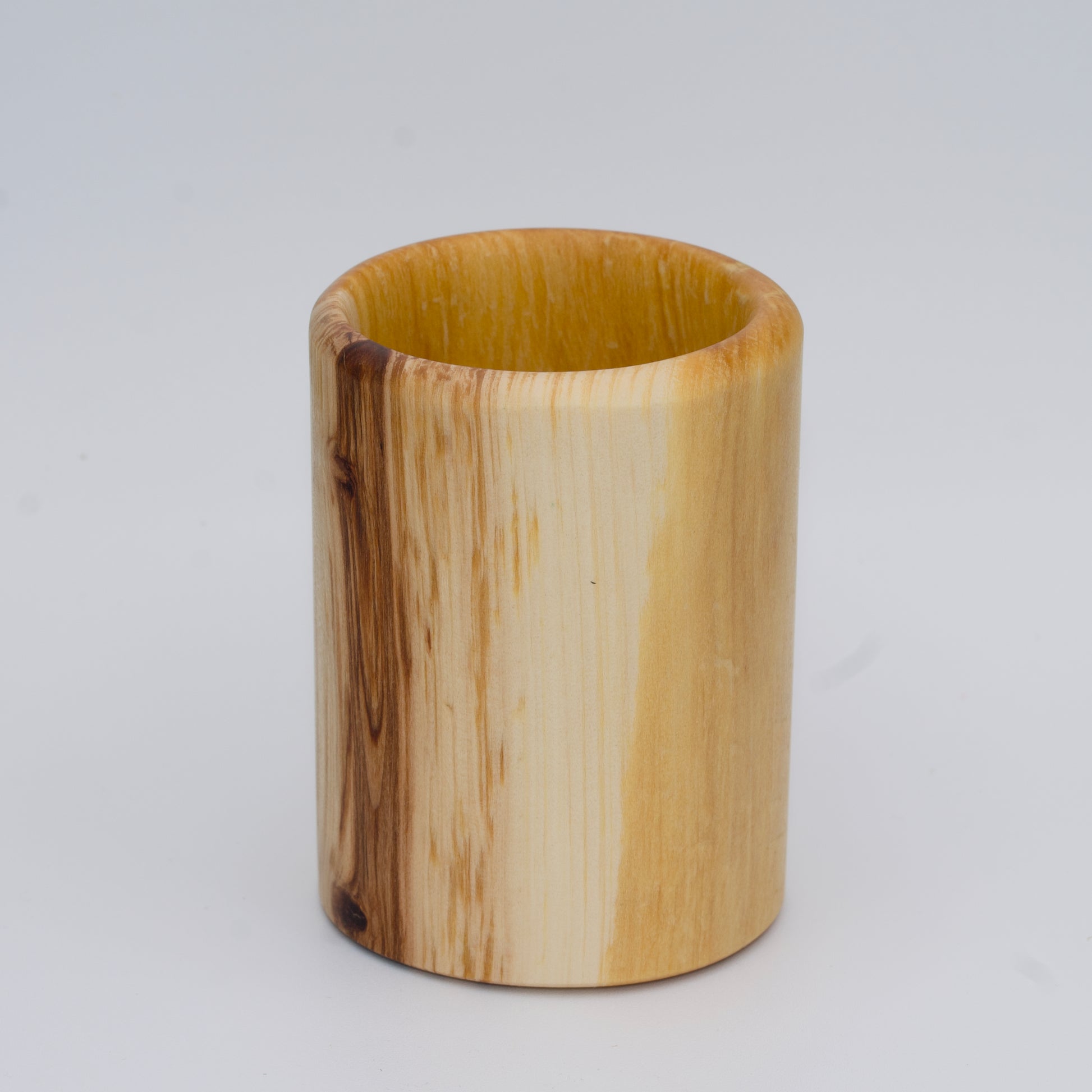 Aspen wood shot glass against white background