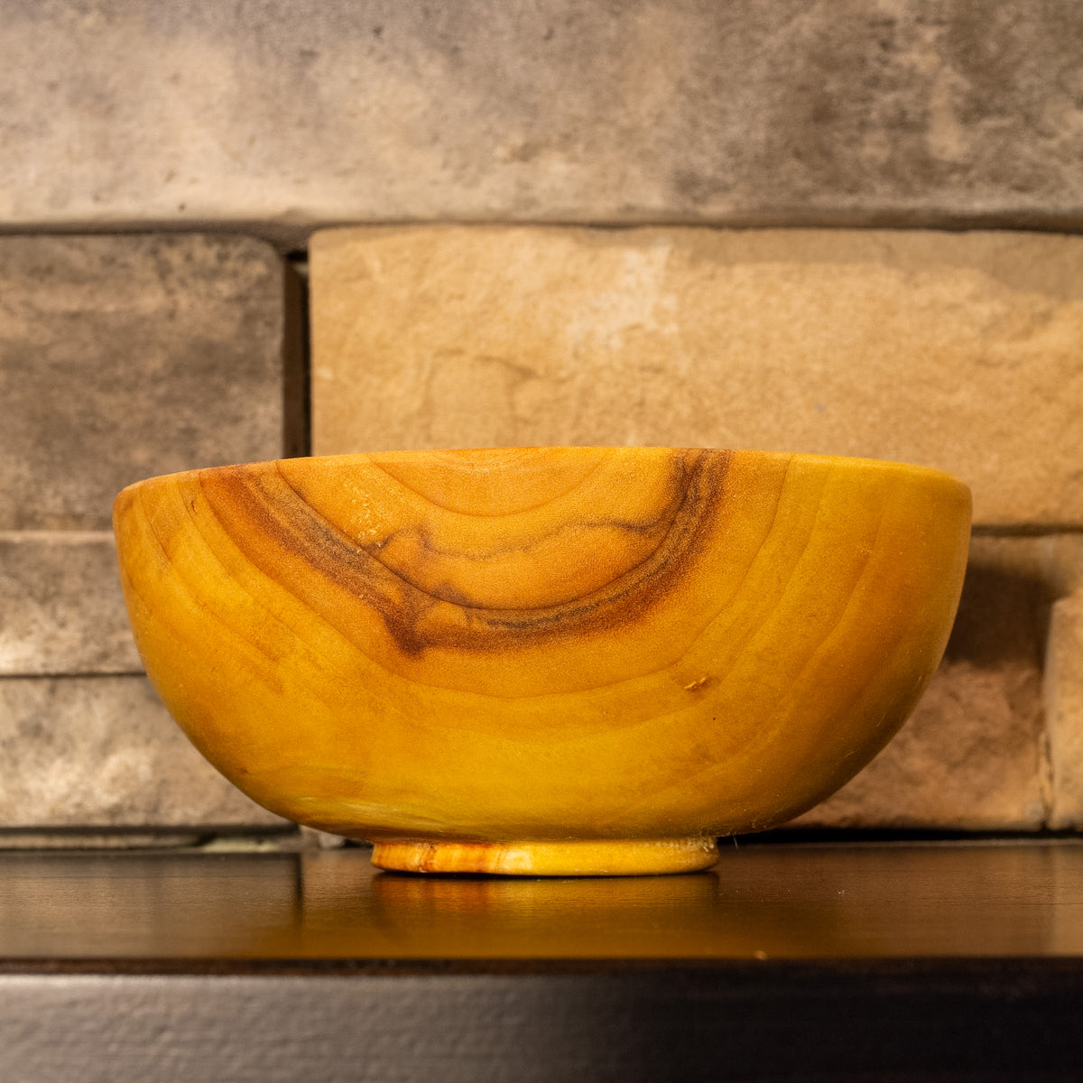 Alternate side view of The High Plains Vessel showing flowing grain and darker streaking along one edge