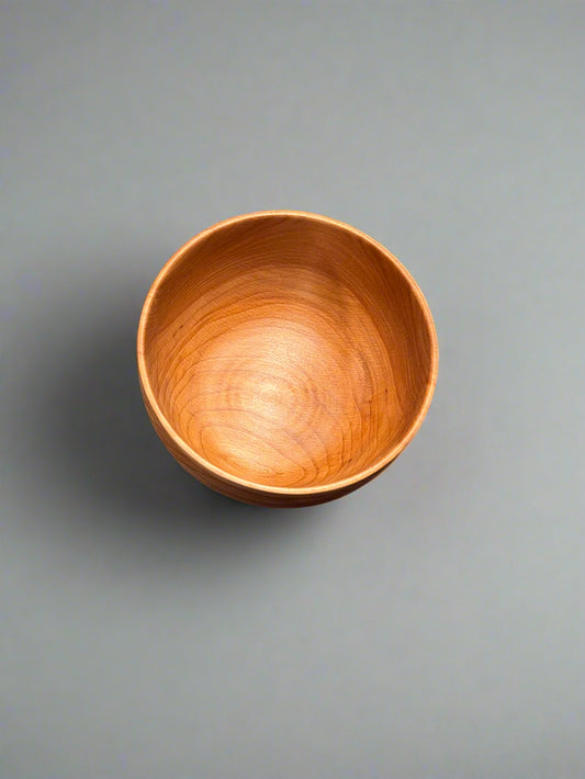 Wooden bowl on a gray background