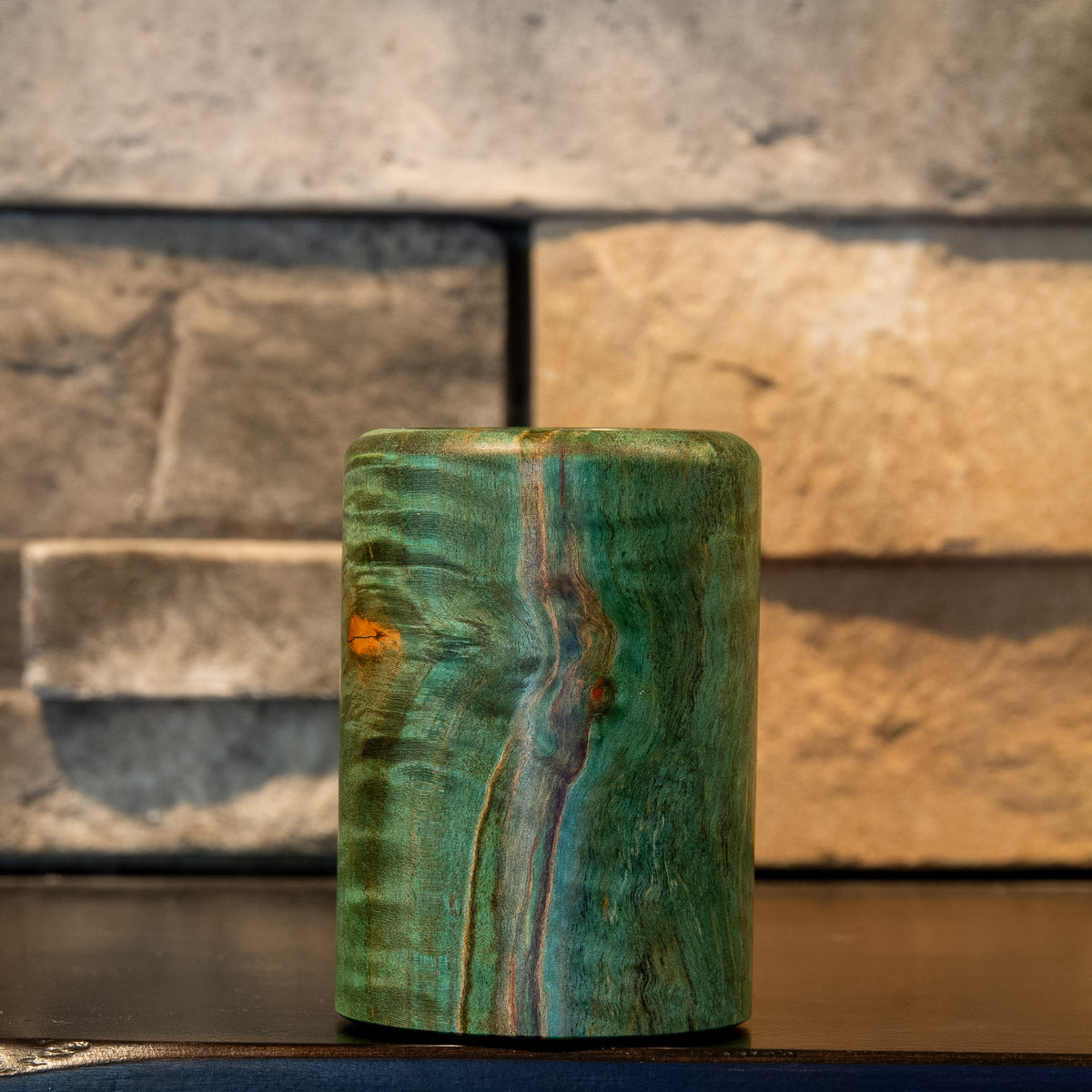 Lichen & Lattice showing teal curly maple figure beside a dark spalted grain line