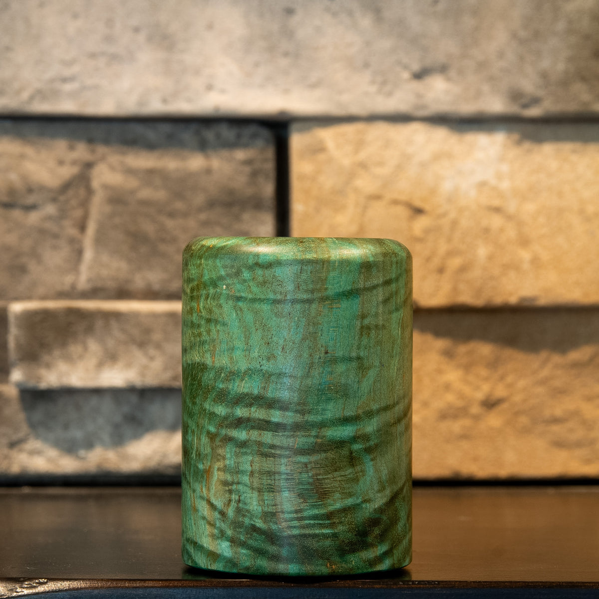 Lichen & Lattice shot glass with dense teal curly figure and darker sweeping grain