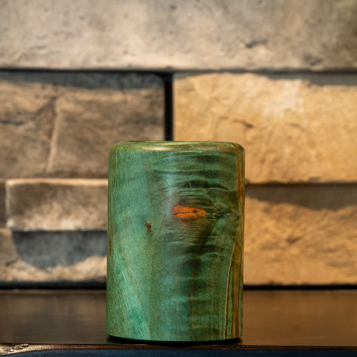 Lichen & Lattice showing orange natural inclusion, teal figure, and spalted grain line