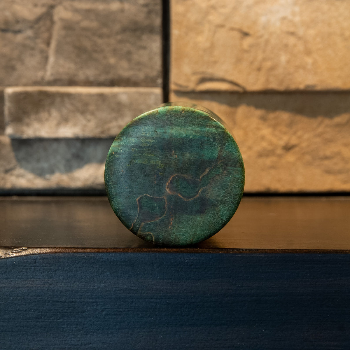 Bottom view of Lichen & Lattice showing teal end grain and dark spalted figure