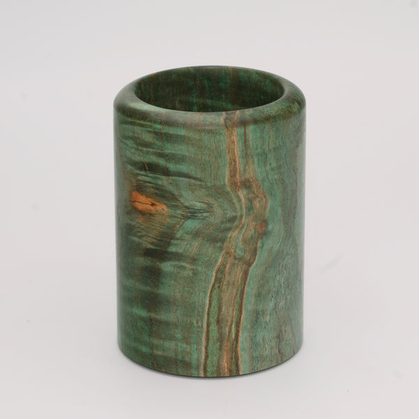 Green dyed curly spalted maple burl shot glass against white background