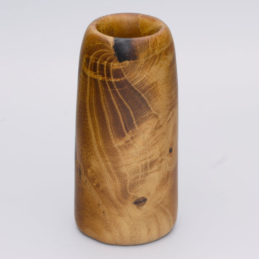 Stunning tall mulberry wood shot glass against white background