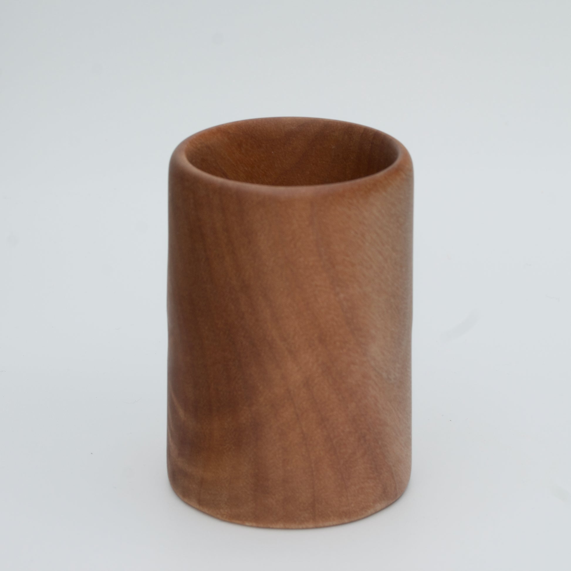 Nara wood shot glass on white background