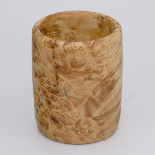 Box Elder burl wood shot glass against white background