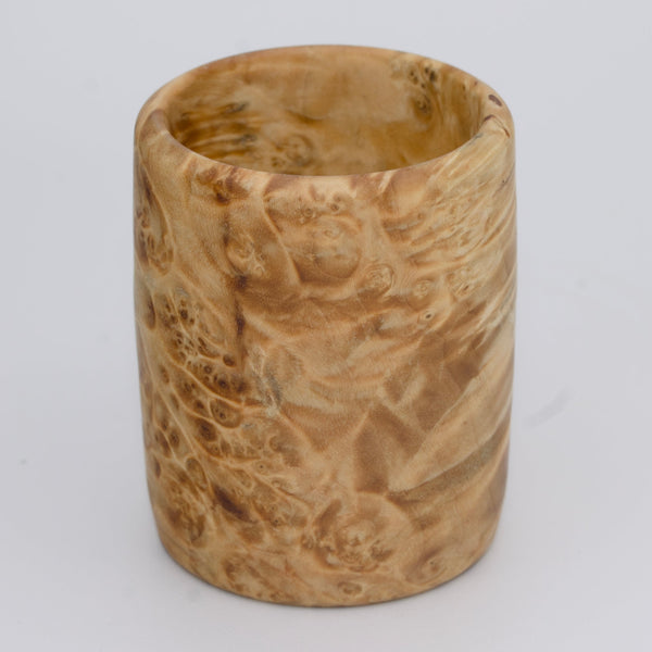 Box Elder burl wood shot glass against white background