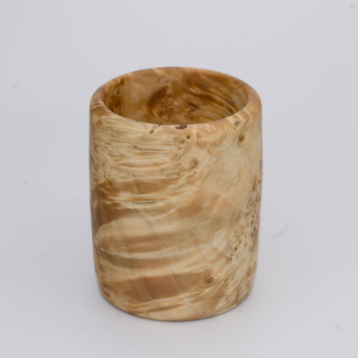 Box Elder burl wood shot glass against white background