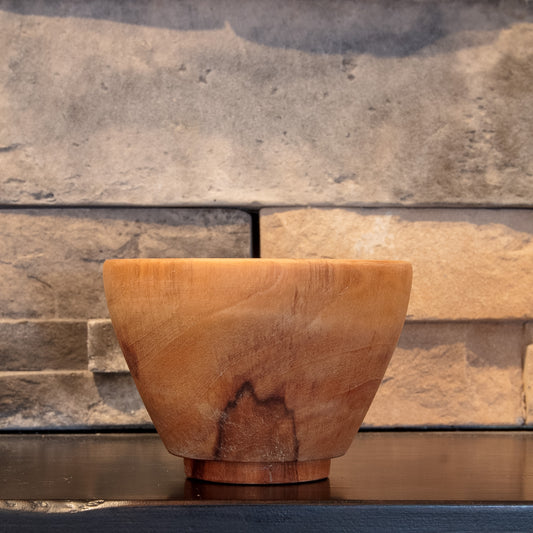 The Wood at Hand rice bowl showing dark natural figure rising from the foot across one exterior face