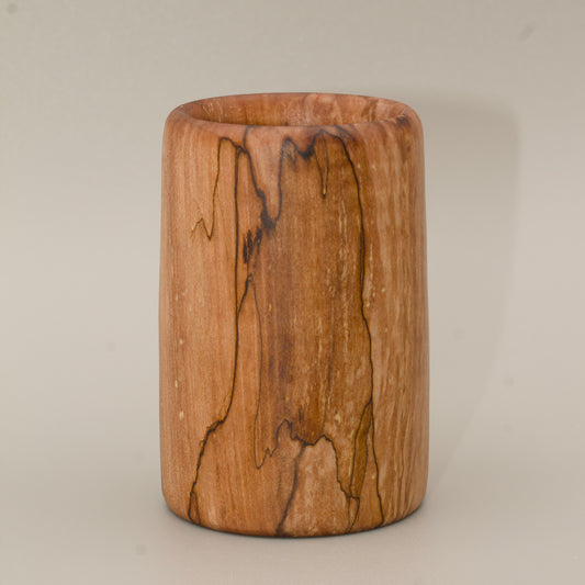 Spalted maple wood shot glass against white background