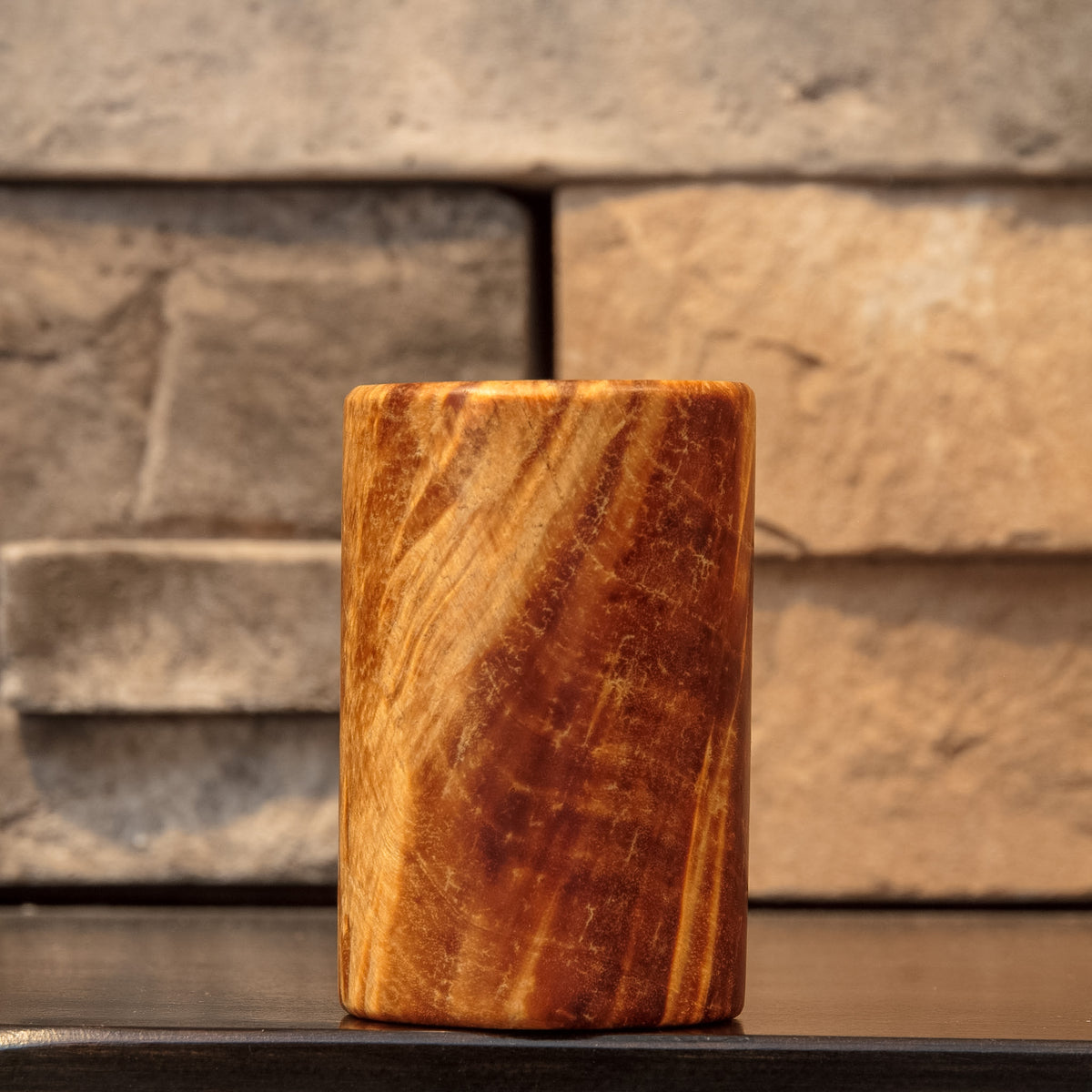 Side view highlighting a broad golden sweep against reddish-brown Box Elder burl figure