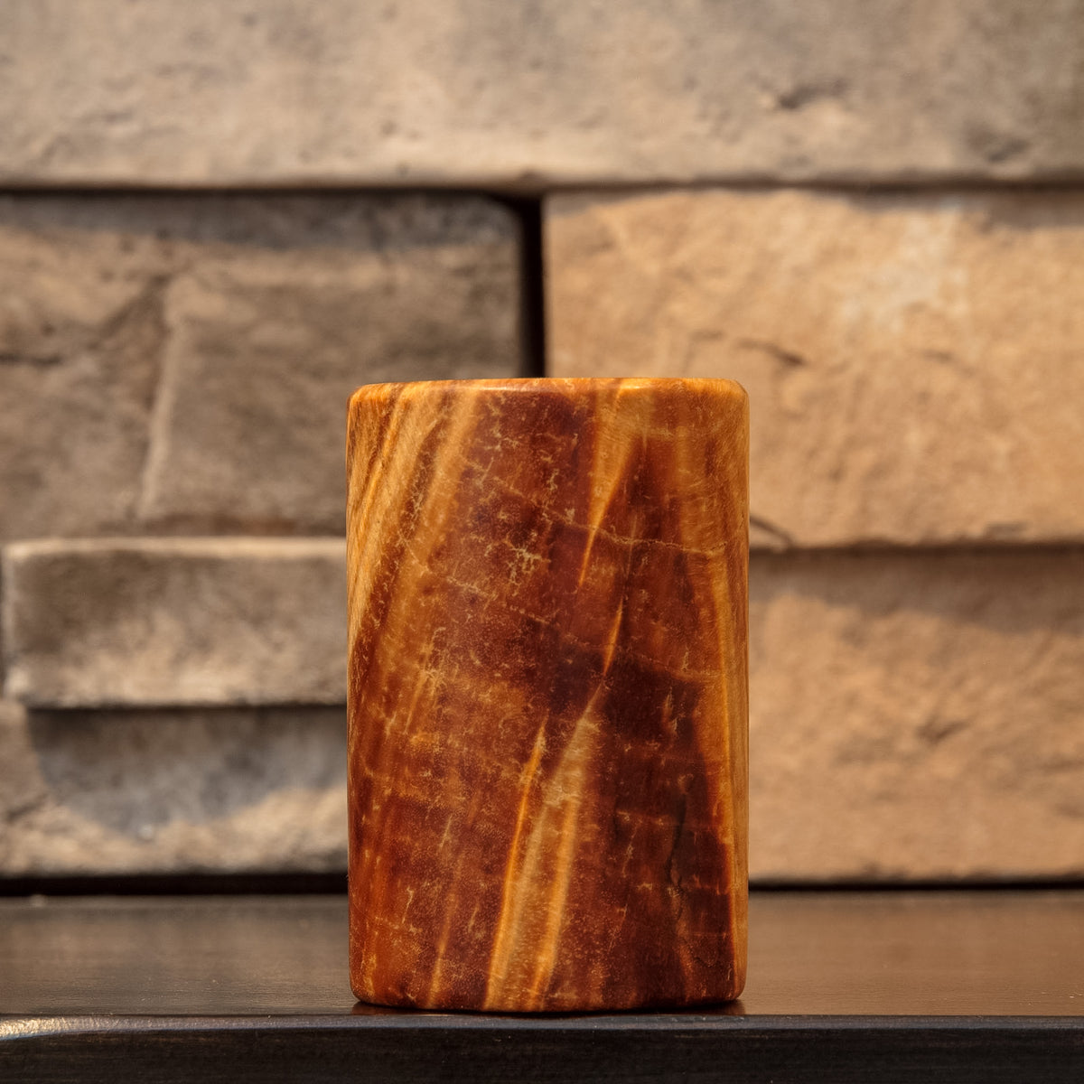 The Caramel Canyon with a narrow golden ribbon running through deep caramel-colored burl grain