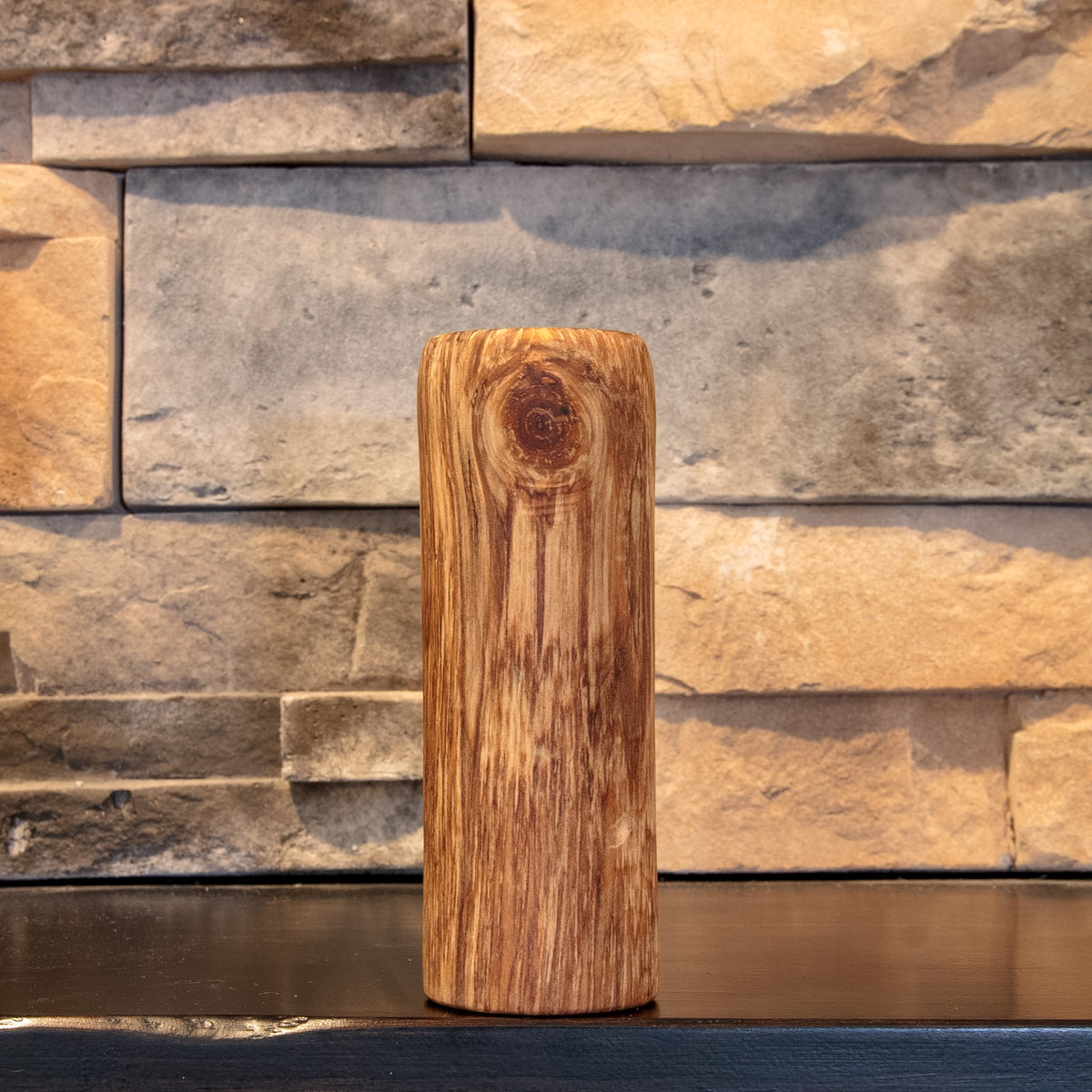 The Eddy Plains Cottonwood shot glass with a round knot near the upper front and vertical grain