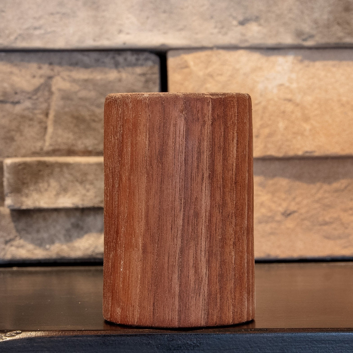 The Find walnut shot glass showing fine dark vertical grain on another side