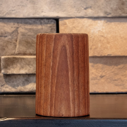 The Find walnut shot glass with curved grain figure centered on the exterior