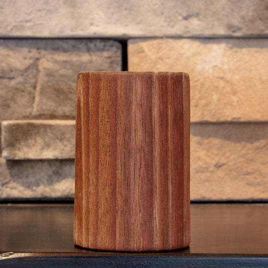 The Find walnut shot glass showing varied reddish-brown vertical grain