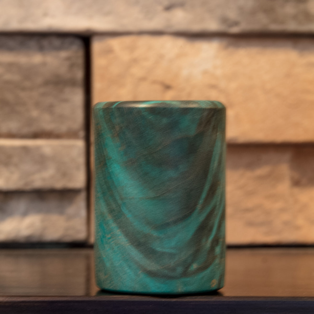 Alternate side of The Forgotten Current showing diagonal dark grain and turquoise figured Mappa Burl