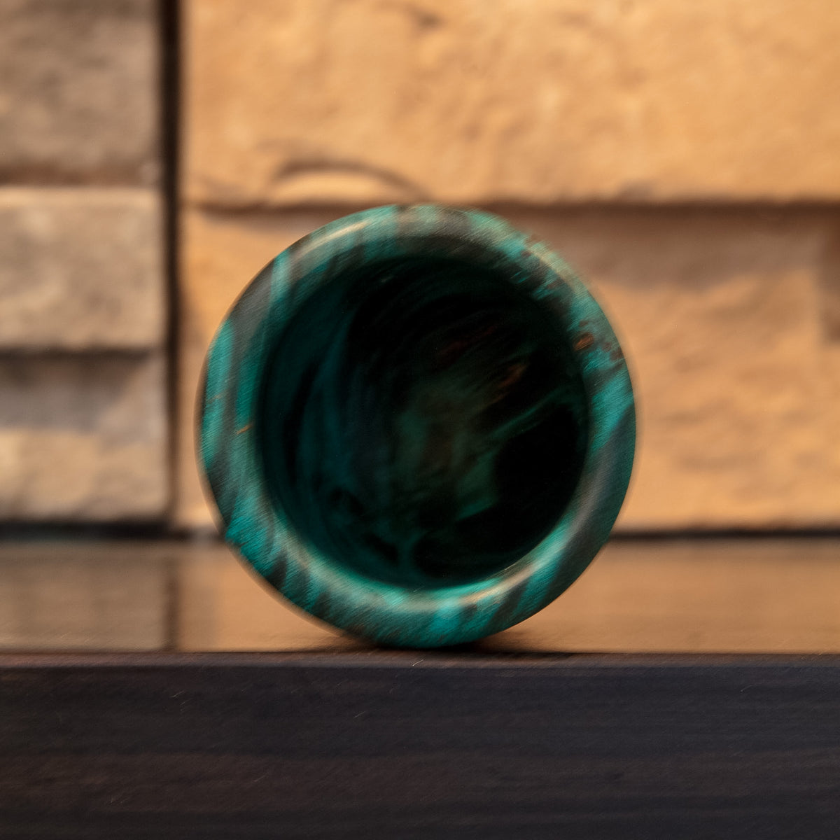 Top opening and dark interior of The Forgotten Current green-dyed stabilized Mappa Burl shot glass