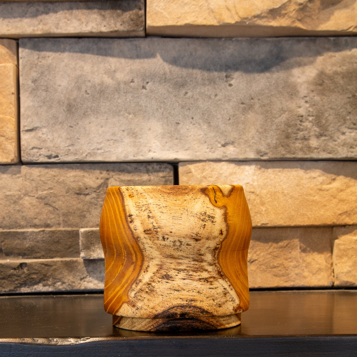 The Gathered Thread White Mulberry whiskey cup showing broad pale sapwood with dark natural boundary lines