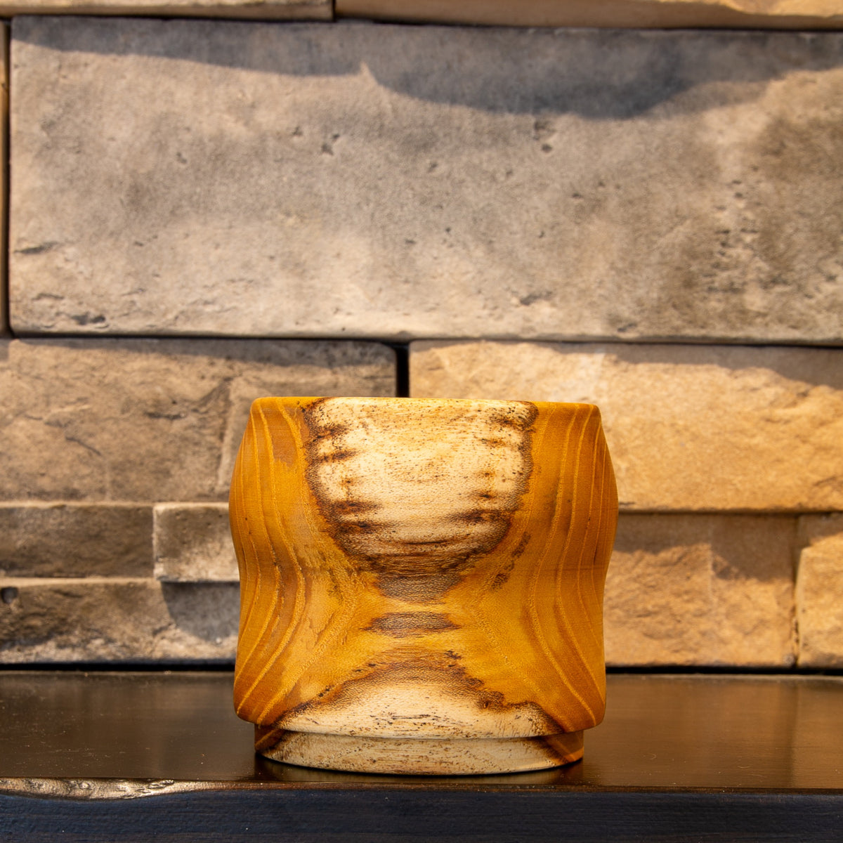 The Gathered Thread whiskey cup showing pale sapwood panels framed by warm White Mulberry heartwood