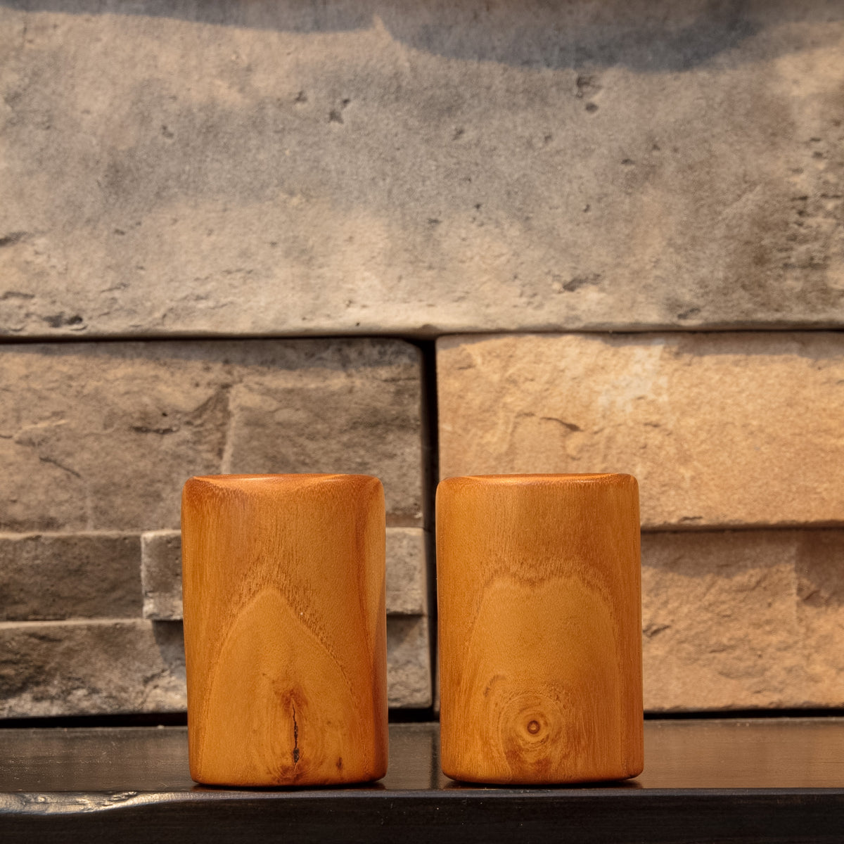 The Golden Orchard White Mulberry shot glass pair rotated to show contrasting grain patterns and small natural character marks