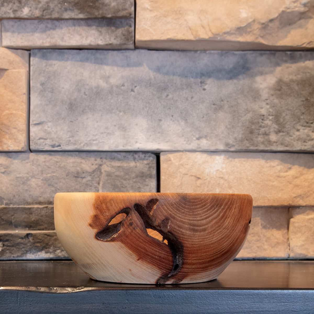 The Space Between American Sycamore bowl showing full profile, contrasting pale and reddish grain, and clustered natural through-voids