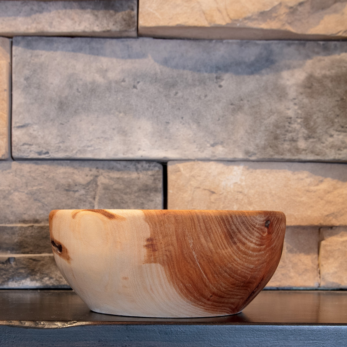 Alternate exterior of The Space Between Sycamore bowl showing pale wood transitioning into reddish curved grain