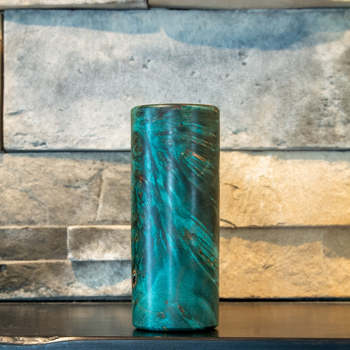 The Verdant Spire showing elongated teal and dark figured grain