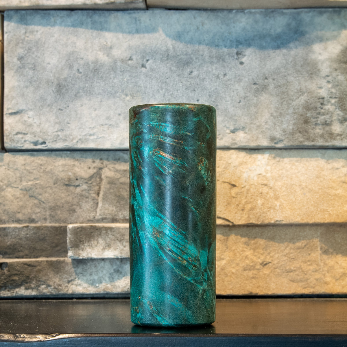 Alternate rotation of The Verdant Spire with teal burl eyes and darker grain