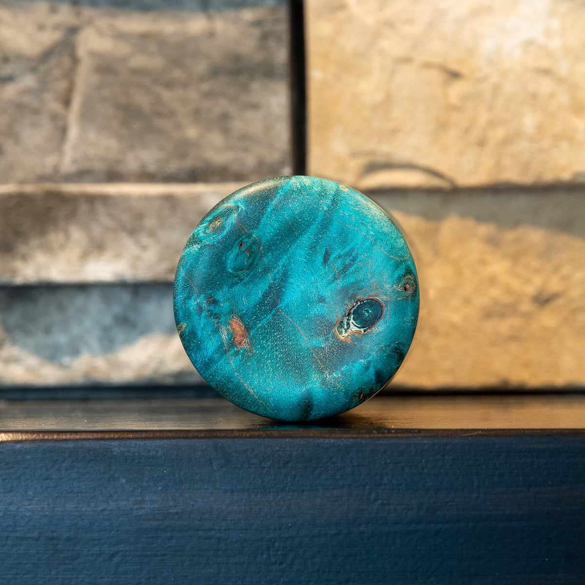 Bottom view of The Verdant Spire showing teal Mappa burl figure and natural inclusions