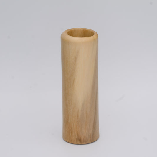 Tall Sweetgum wood shot glass against white background