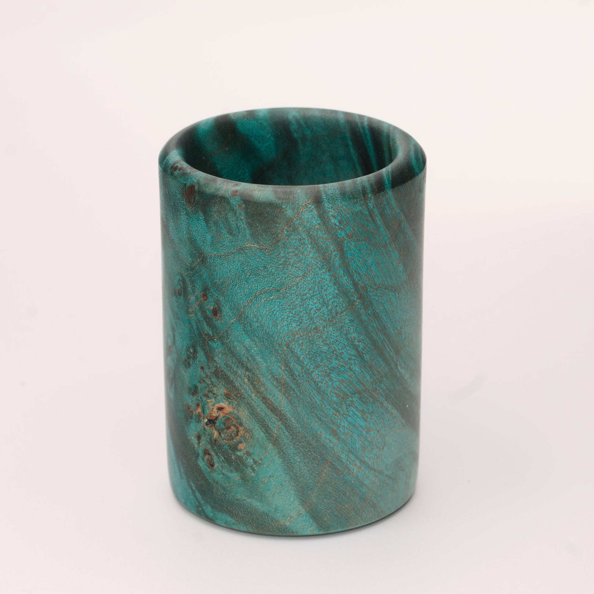 Green dyed Mappa Burl shot glass against white background
