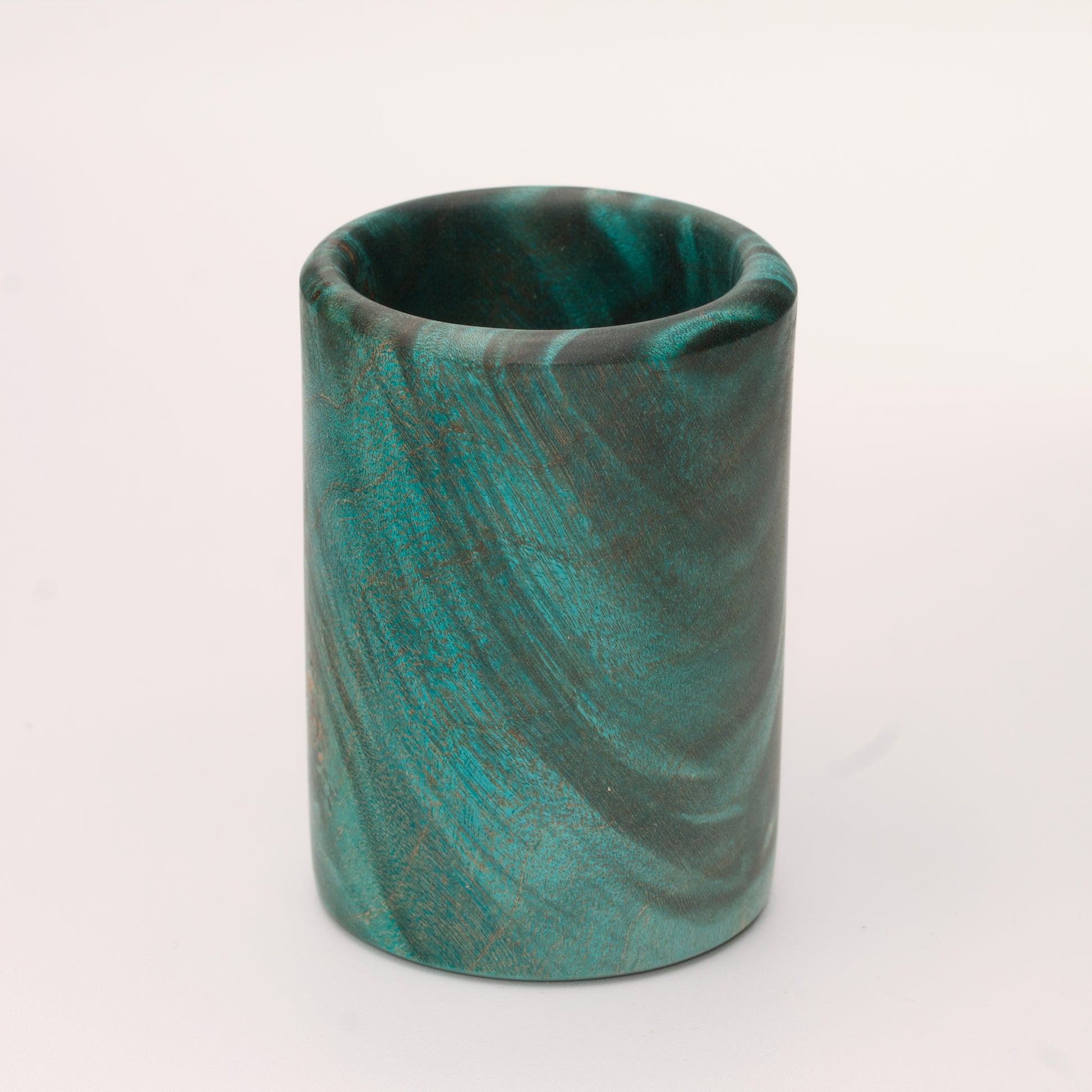 Green dyed Mappa Burl shot glass against white background