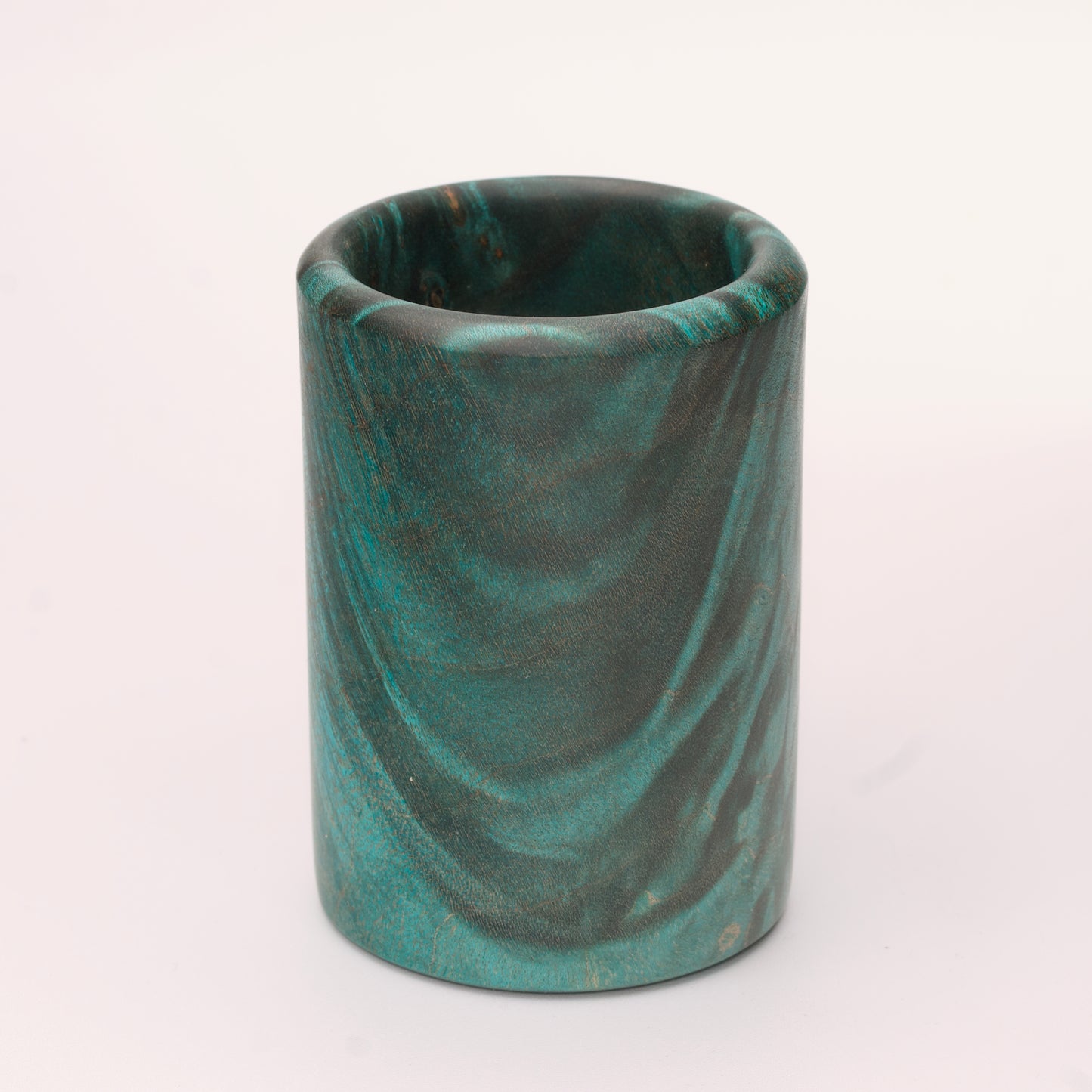 Green dyed Mappa Burl shot glass against white background