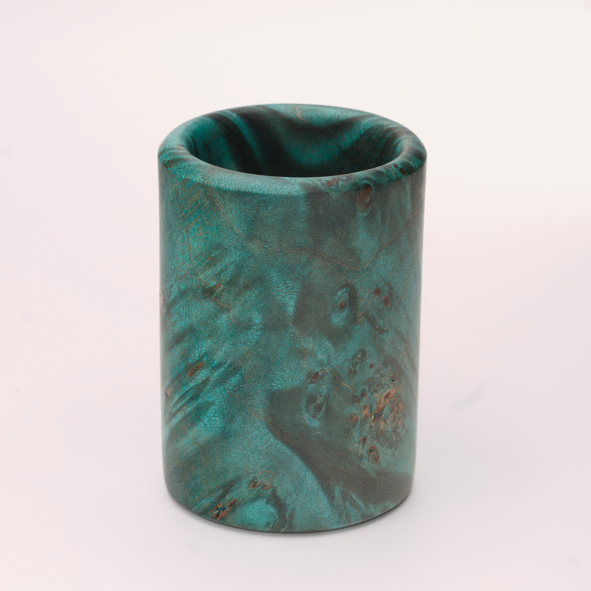 Green dyed Mappa Burl shot glass against white background