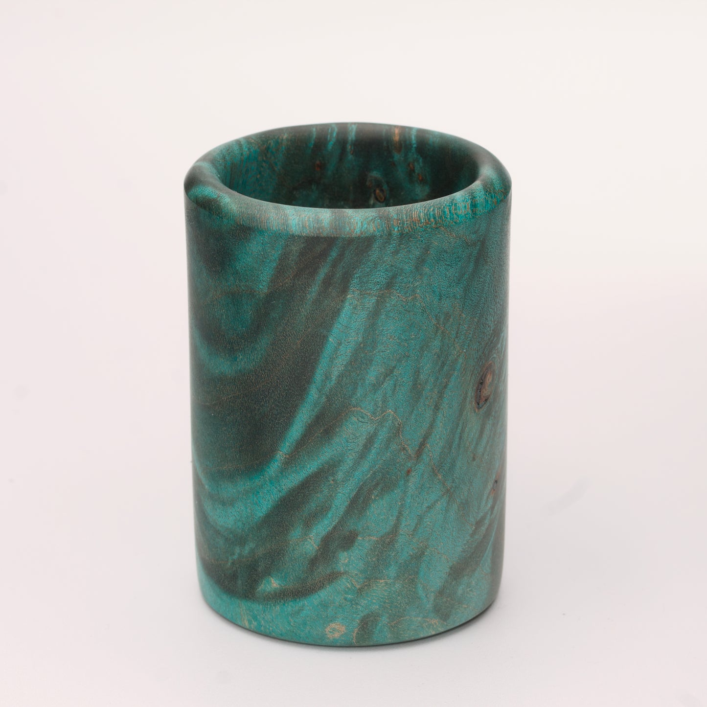 Green dyed Mappa Burl shot glass against white background