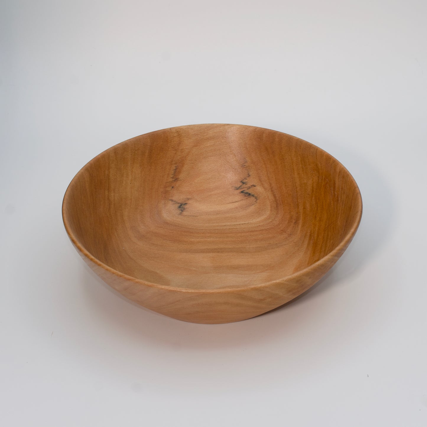 Wooden bowl on a white background
