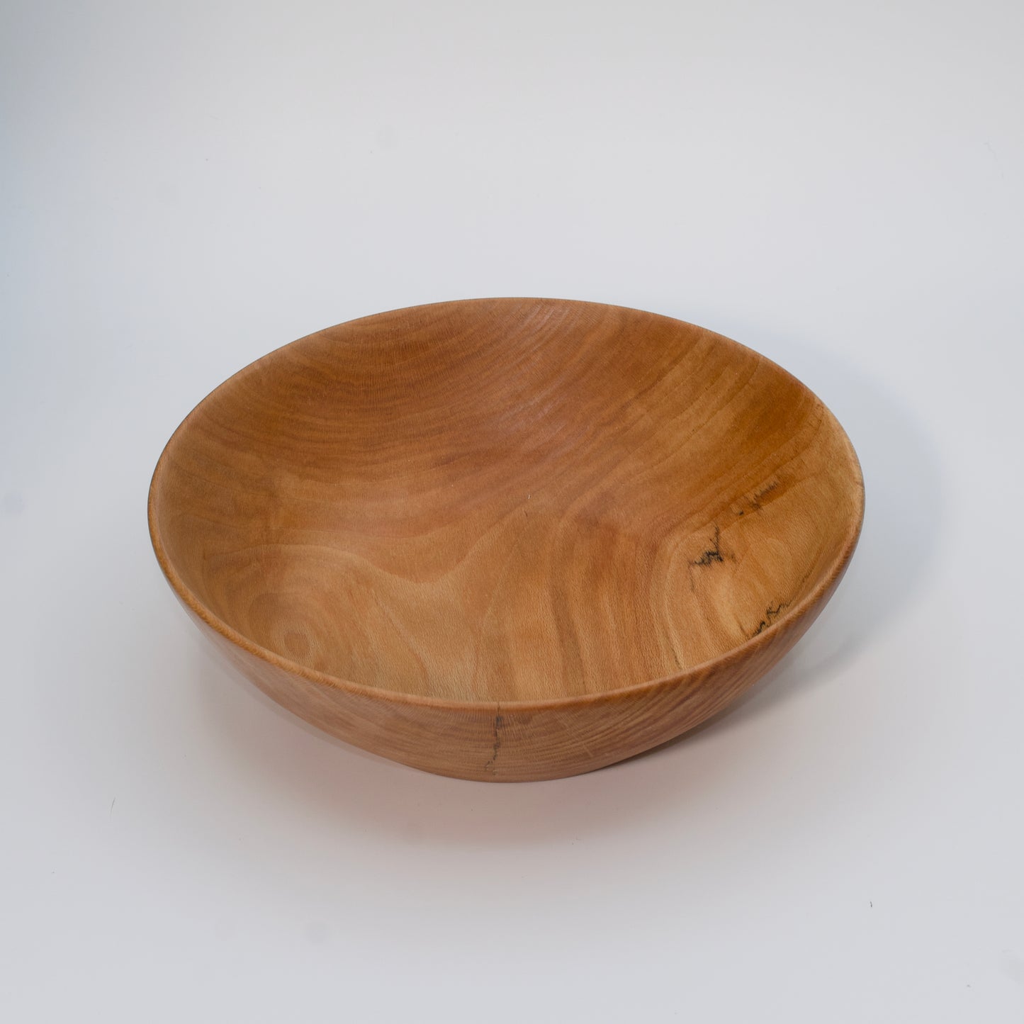 Wooden bowl on a white background