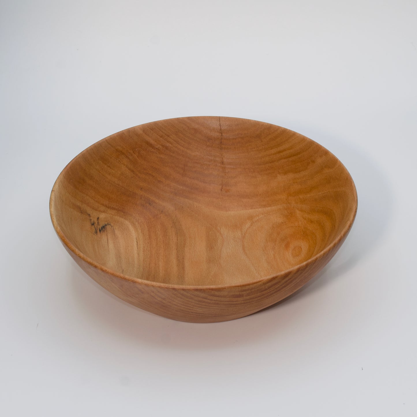 Wooden bowl on a white background