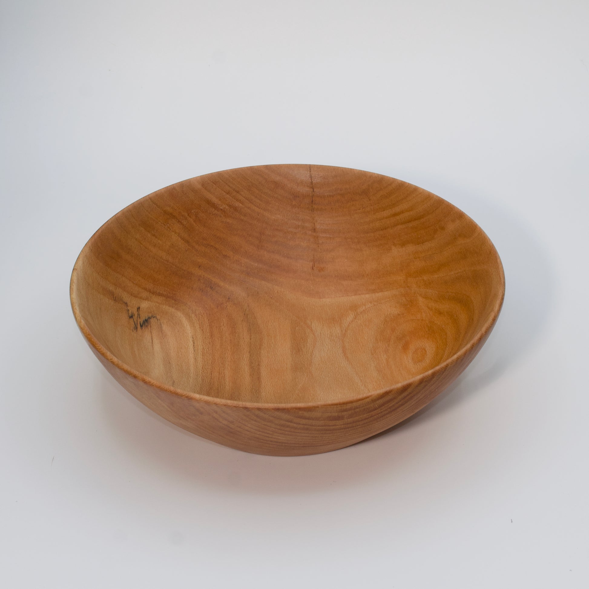 Wooden bowl on a white background