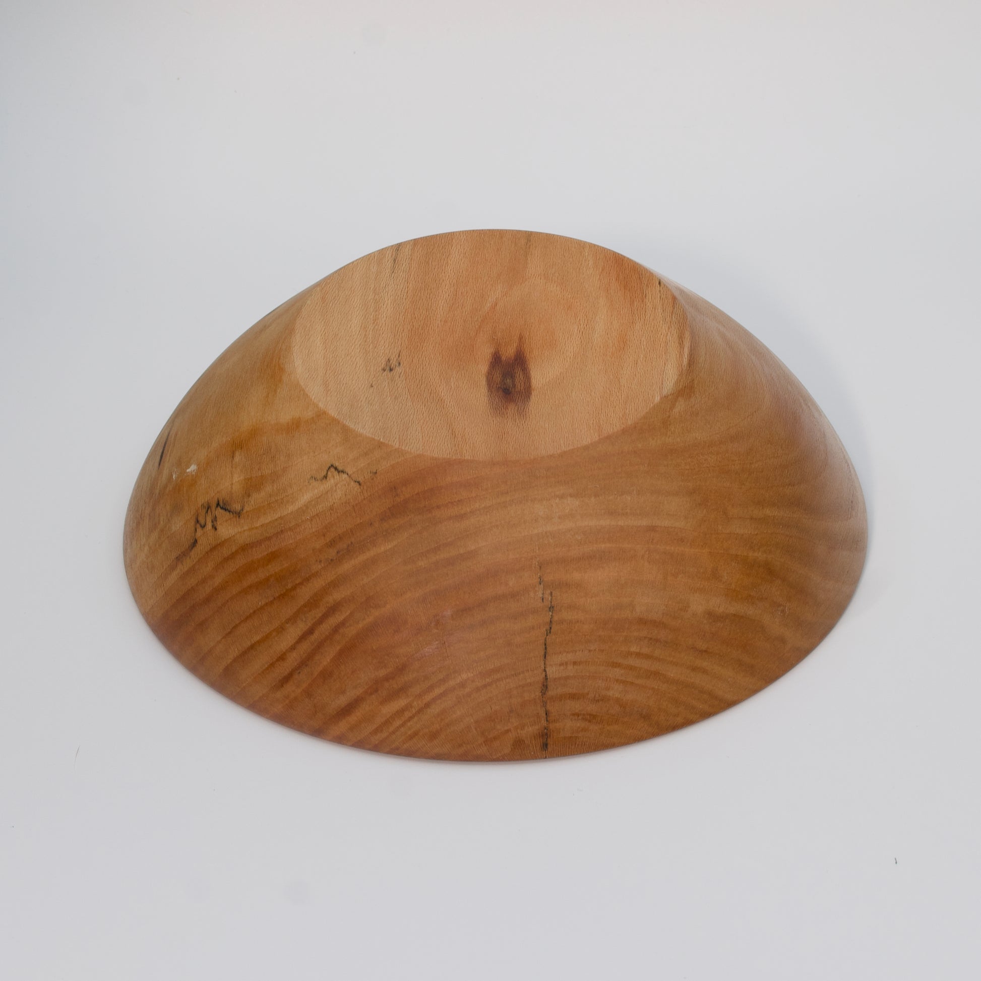 Wooden bowl on a white background