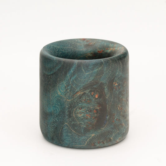 Blue maple burl wood shot glass against white background