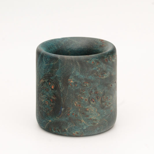 Blue maple burl wood shot glass against white background