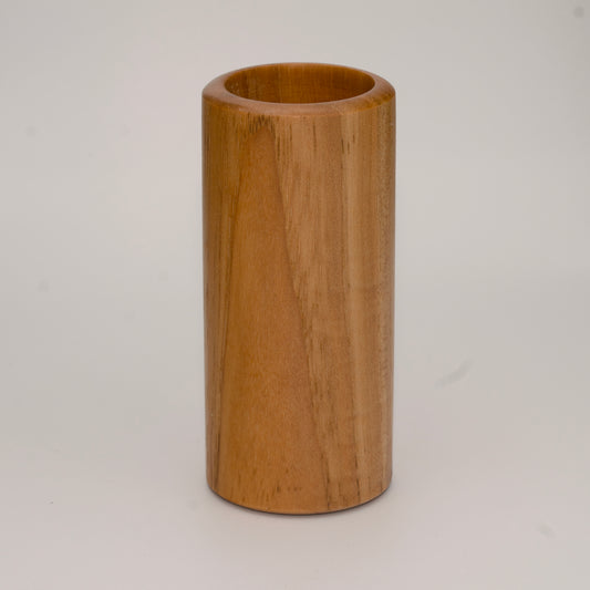 Tall pecan wood shot glass against white background