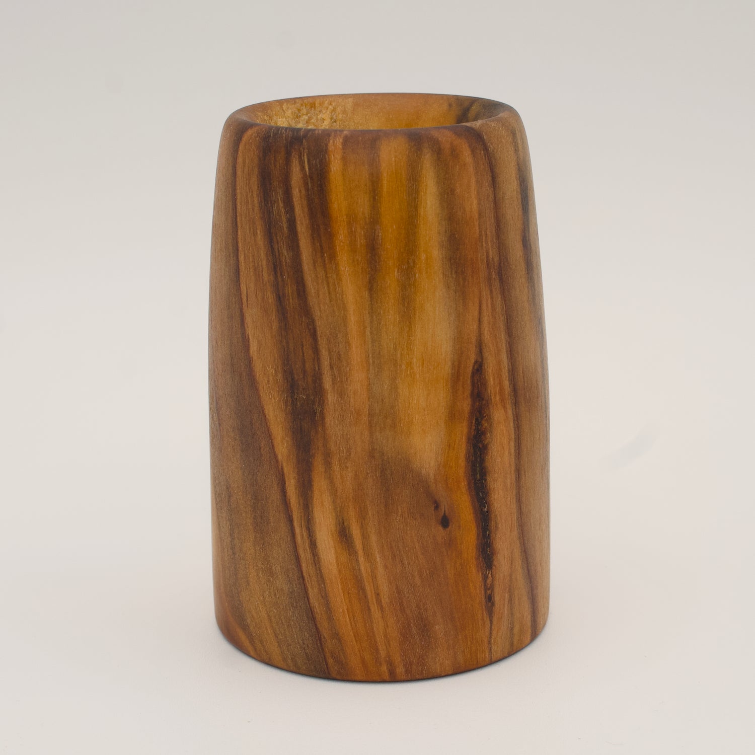 Plains cottonwood aztec gold dyed wood shot glass on white background