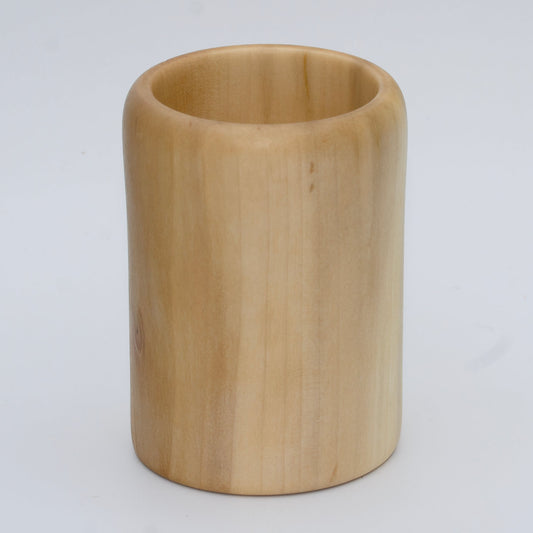 Sweetgum wood shot glass against white background