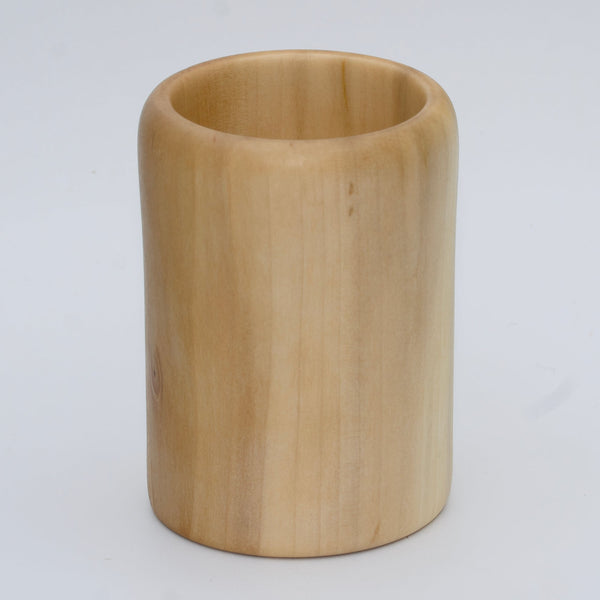 Sweetgum wood shot glass against white background